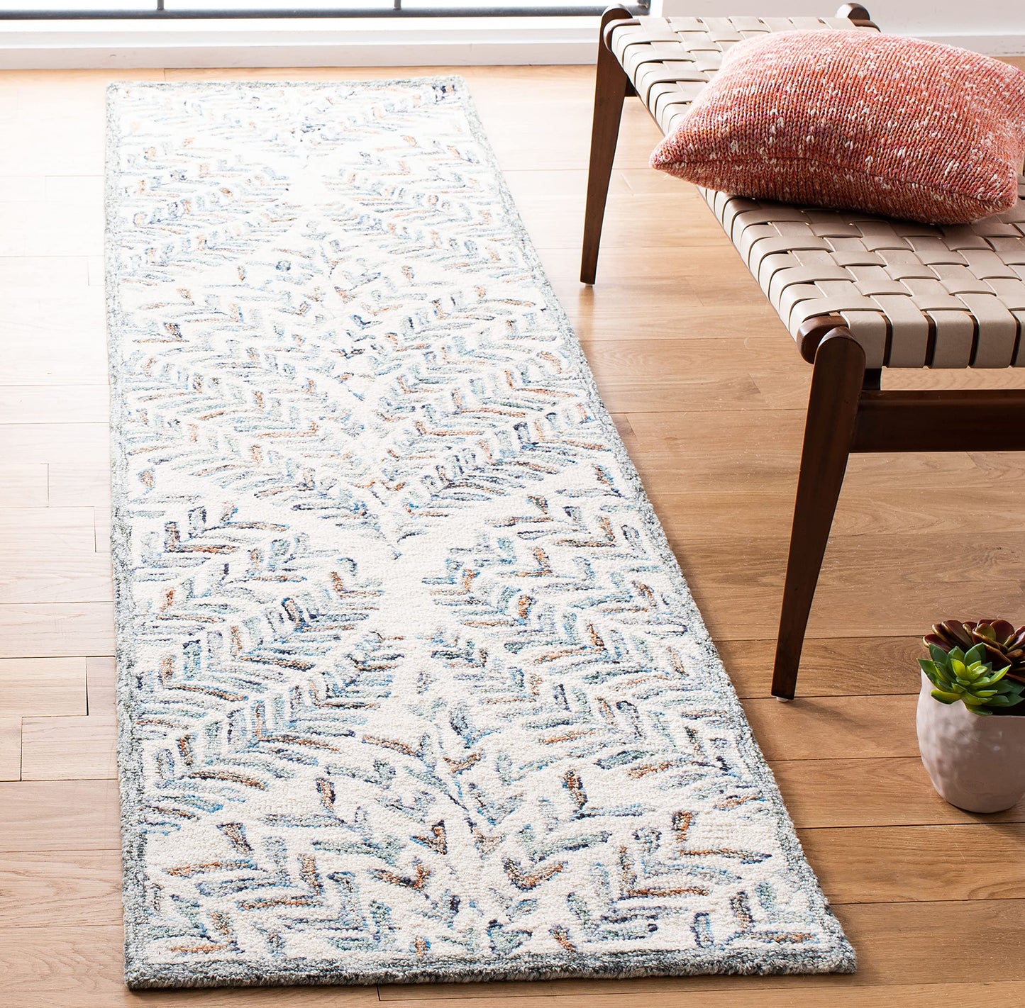 SAFAVIEH Capri Collection Area Rug - 2'3" x 11', Ivory & Blue, Handmade Wool, Ideal for High Traffic Areas in Living Room, Bedroom (CPR208A)