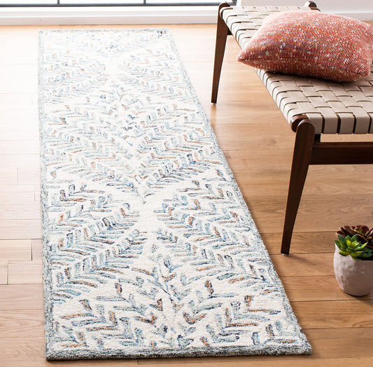 SAFAVIEH Capri Collection Accent Rug - 2'3" x 5', Ivory & Blue, Handmade Wool, Ideal for High Traffic Areas in Entryway, Living Room, Bedroom (CPR208A)