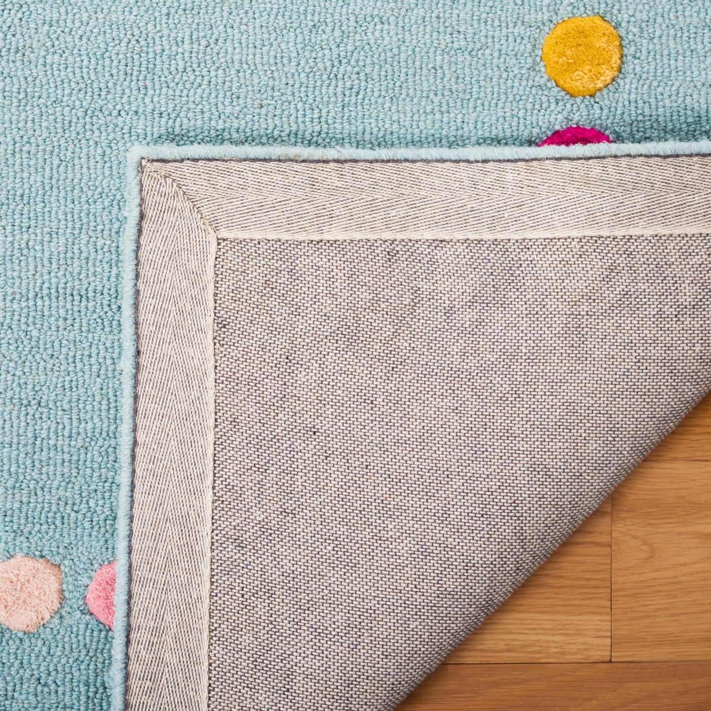 SAFAVIEH Kids Collection Area Rug - 5' Round, Blue & Pink, Polka Dot Border Design, Handmade Wool, Ideal for the Kids Room, Playroom, Nursery (SFK928M-5R)
