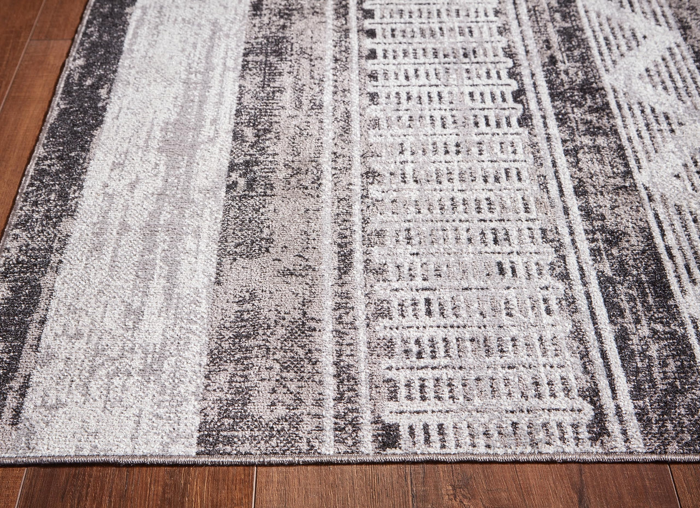 Signature Design by Ashley Henchester Contemporary 5' x 7' Machine Woven Tribal Pattern Medium Area Rug, Low Pile, Machine Washable, Multicolor